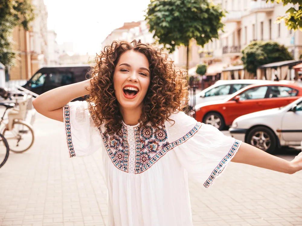 Digital Perm: What Are Digital Perms and How Do They Work? 10 The lady's medium hair length has undergone a remarkable transformation, transitioning from straight to wavy with the help of a digital perm service.