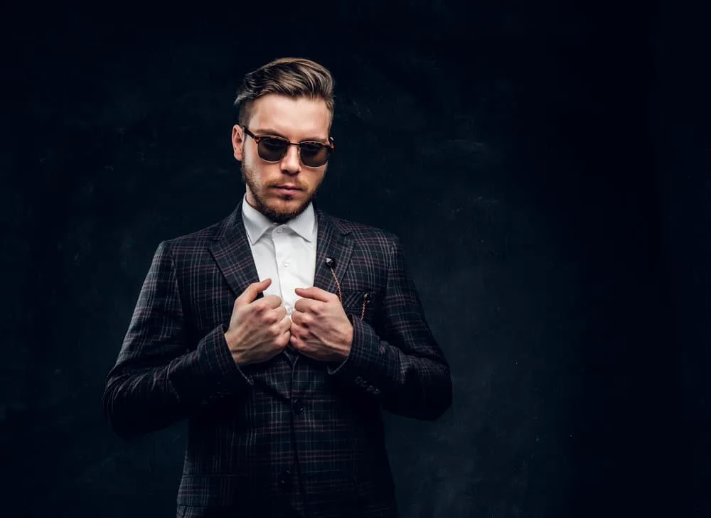 Peaky Blinders Haircut: How to Do Peaky Blinders Haircuts 5 With John Shelby's haircut and a bushy lumberjack beard, the young man showcases a perfect blend of ruggedness and style.