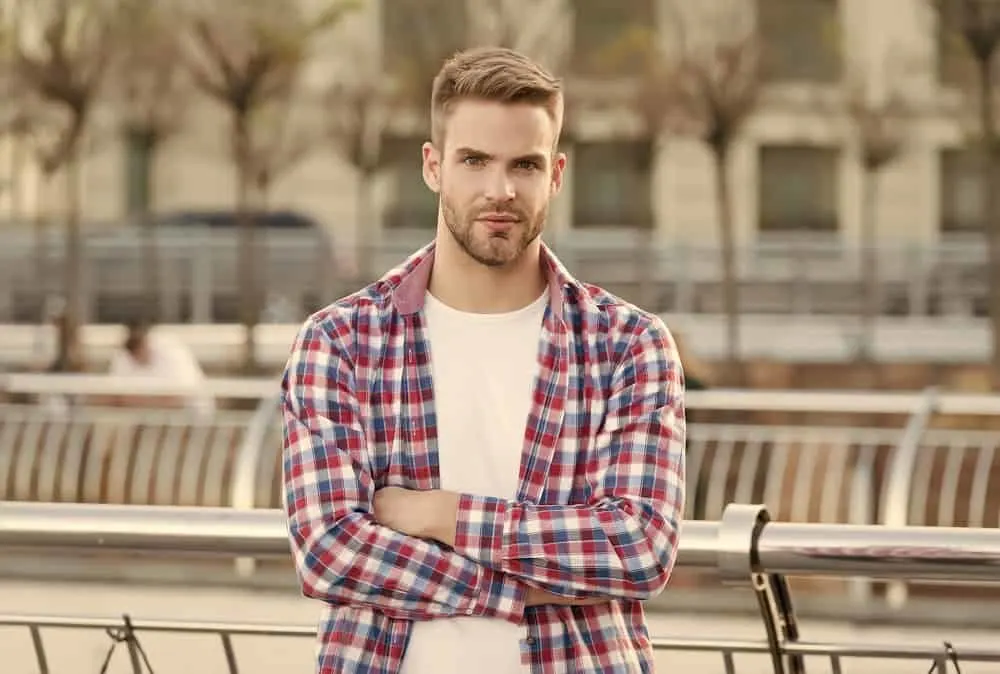 Hairstyles for Men with Big Foreheads: Step-by-Step Tutorials 15 The bowl cut, with its even length all around, creates a clean and minimalist look that accentuates his facial structure.