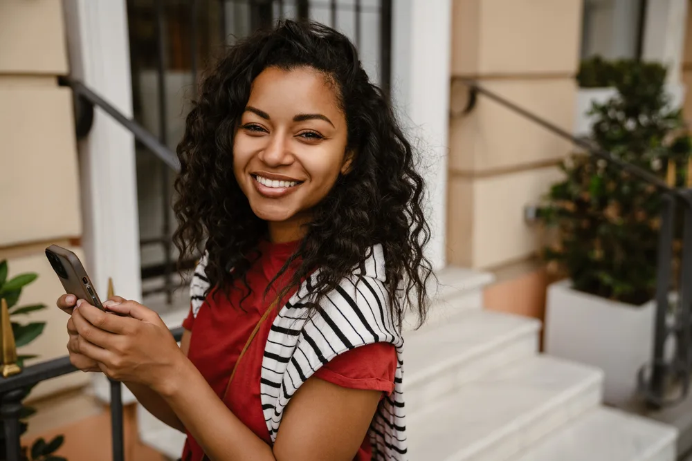 How to Sleep with Curly Hair: Best Ways to Sleep with Curls 12 Her hair's natural oils are preserved as she avoids over-washing and excessive heat styling, maintaining the health of her natural hair.