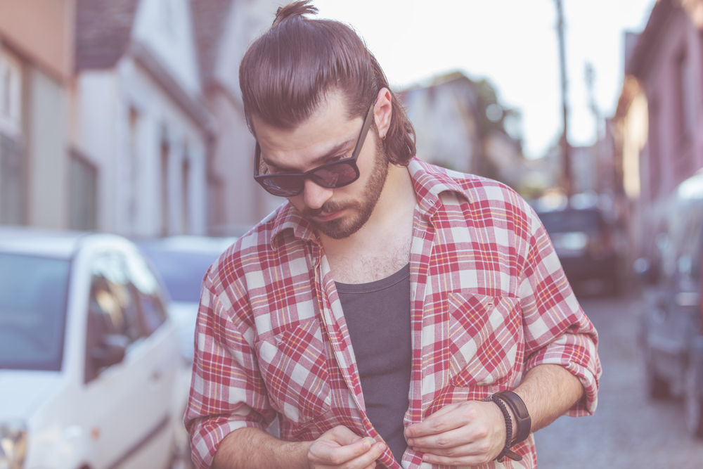 His slightly longer locks in the back of the Mexican mullet provide a playful and trendy touch to his overall hairstyle.