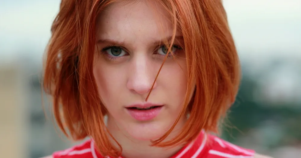 Short Hairstyles for Teens: Hairstyle Ideas for Teenage Girls 23 An adult female wearing a sexy short straight bob dyed her naturally blonde hair red to create an attractive style with crazy messy layers.
