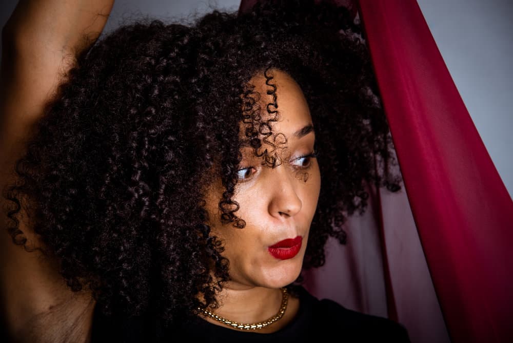Embracing her curly girl identity, she opts for a drying method that preserves the integrity of her coily hair, minimizing damage and maximizing natural beauty.