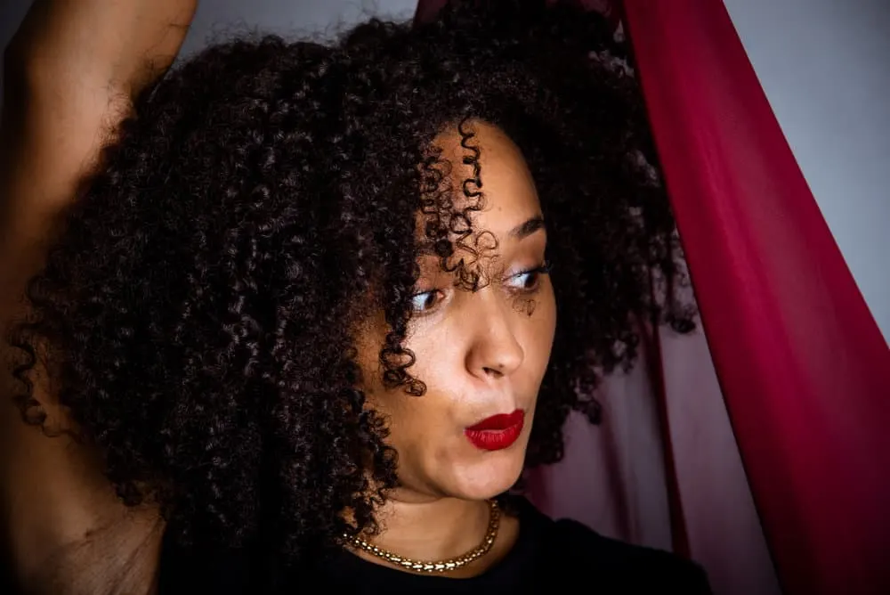 How to Diffuse Curly Hair: Diffusing Curly Hair for Beginners 3 Embracing her curly girl identity, she opts for a drying method that preserves the integrity of her coily hair, minimizing damage and maximizing natural beauty.