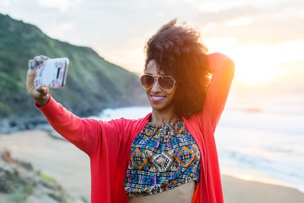 She applies diluted neem oil to her dry and itchy scalp, combating dryness, itchiness, and scalp inflammation for a healthier hair environment.