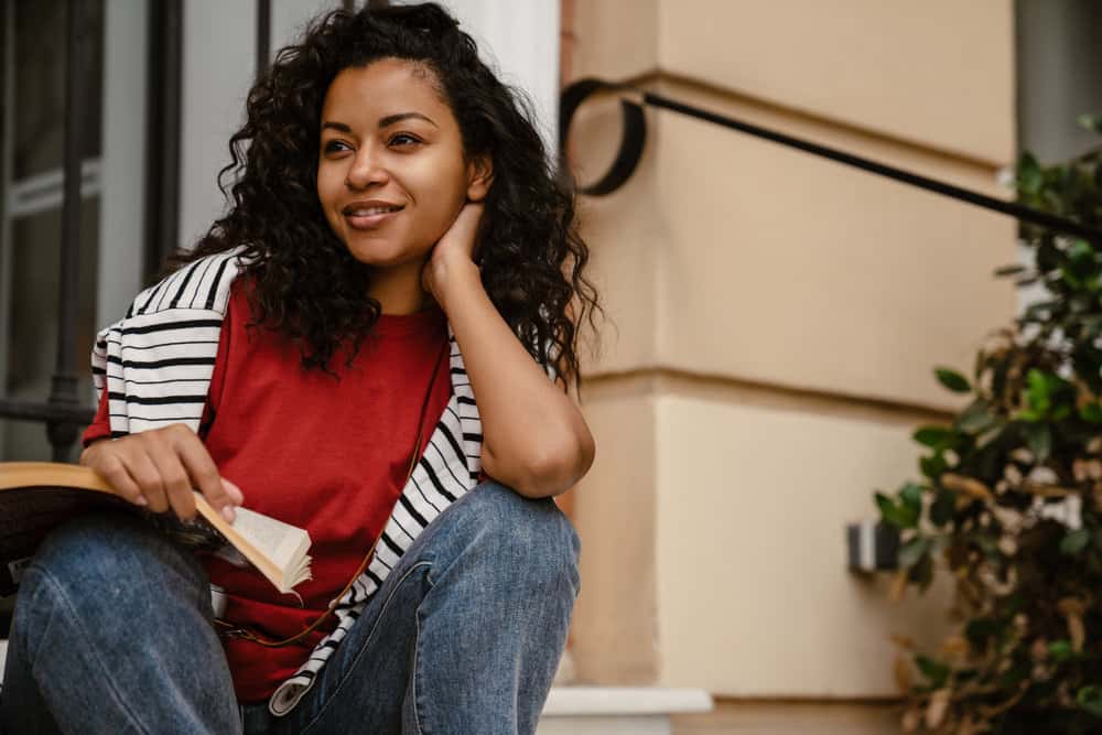 This curly girl understands the importance of properly washing her short hair, using techniques that preserve curl pattern and minimize frizz.