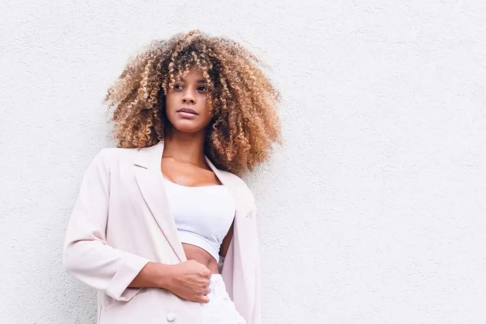 How to Brush Curly Hair Without Losing Curls or Frizzy Hair 3 She understands the importance of learning how to brush curly hair correctly, using a soft hair brush or a detangling brush to maintain her healthy hair strands.