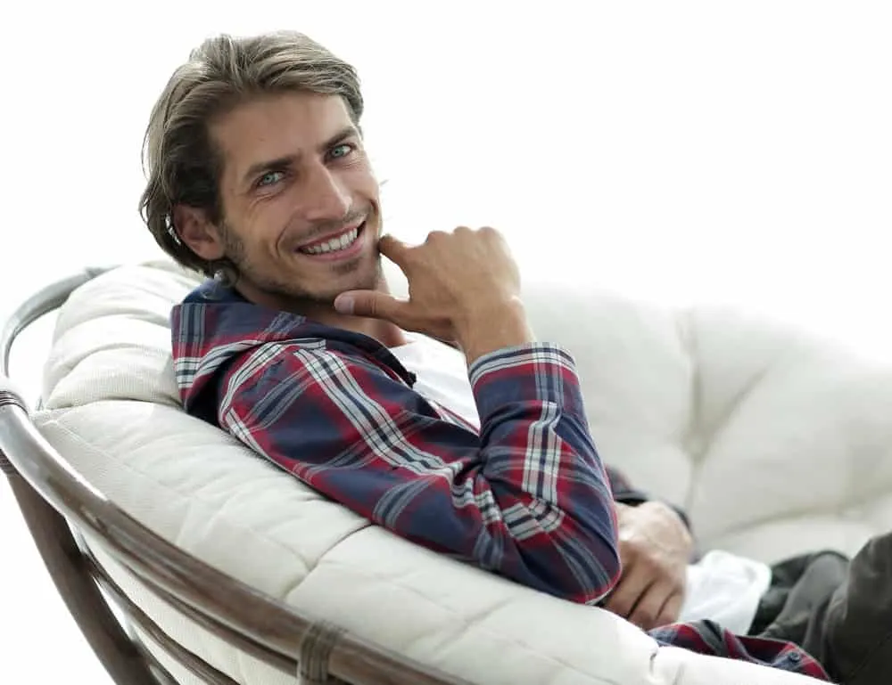The Best Straight Hair Hairstyles: Men's Styles and Haircuts 6 With his long, straight hair styled to perfection, the white man exudes a captivating charm that draws attention to his facial features.