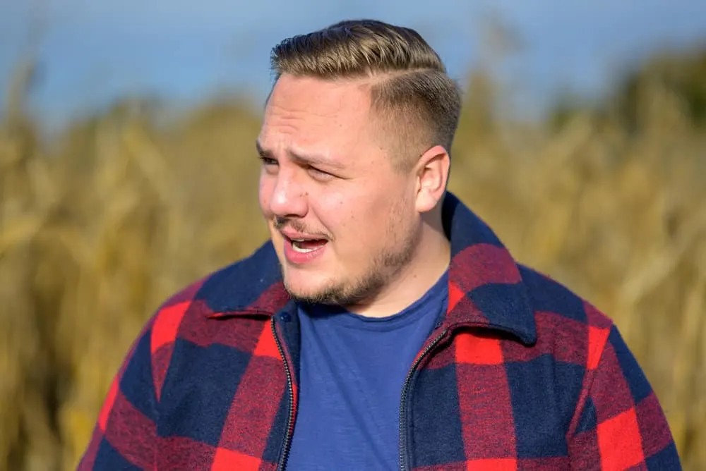 Best Haircuts for Men with Round Faces: Chubby Hairstyles for Guys 21 With long hair in a pompadour hairstyle, the young man achieves a clean and tailored look that suits a round face male.