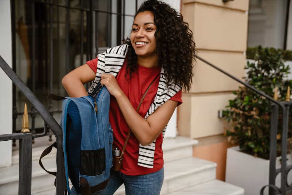 With a curated curly hair night routine, she wraps her hair in a satin scarf or bonnet, enhancing the health and hydration of her hair strands.