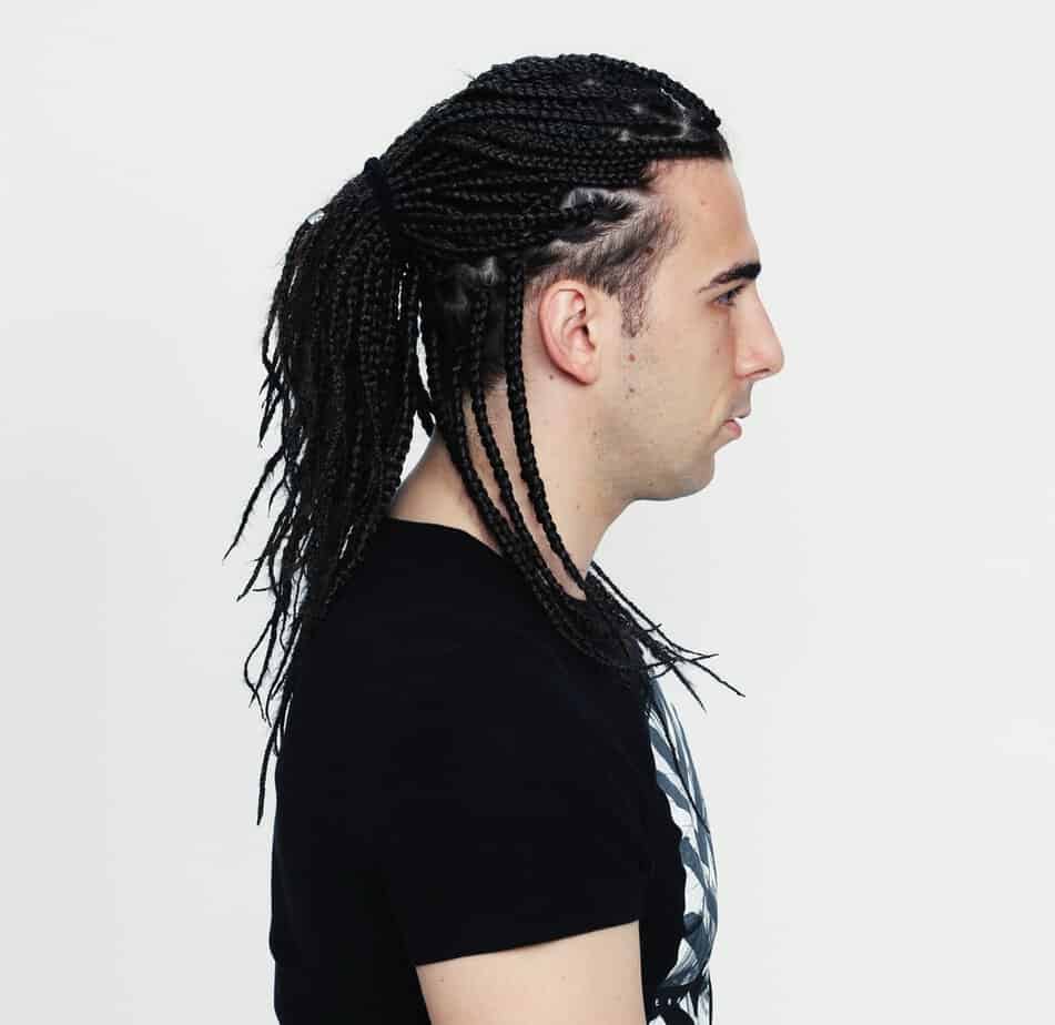The white man's box braids, although not traditionally associated with his ethnicity, challenge societal norms and highlight the beauty of diverse hair styles.
