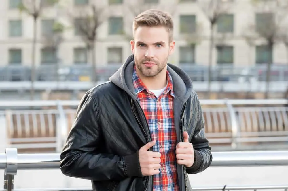 Hairstyles for Men with Big Foreheads: Step-by-Step Tutorials 23 The high fade haircut draws attention upwards, diverting the gaze from his forehead and showcasing his stylish sense of fashion.