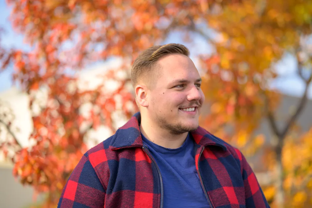 Best Haircuts for Men with Round Faces: Chubby Hairstyles for Guys 6 With his thinning facial hair and a high and tight fade, the young man achieves a stylish and clean-cut look that suits his round face.