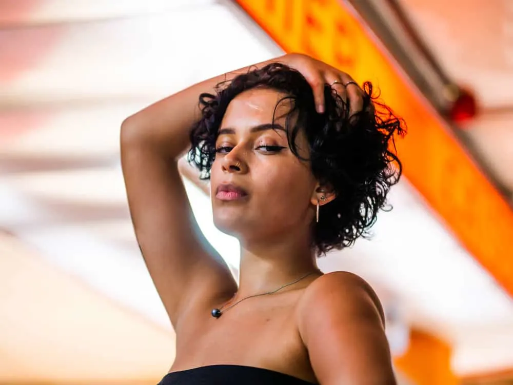The Bisexual Haircut: How to Create Bi Haircuts & Hairstyles 6 Rocking a traditional bob, the young woman proudly displays her support for queer women and embraces her own sense of style.