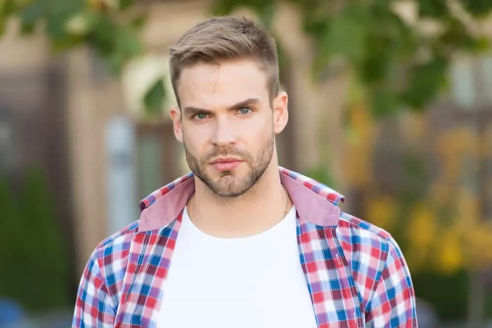 Hairstyles for Men with Big Foreheads: Step-by-Step Tutorials 5 The brushed up hairstyle adds height and volume, drawing attention away from his larger forehead and highlighting his facial features.
