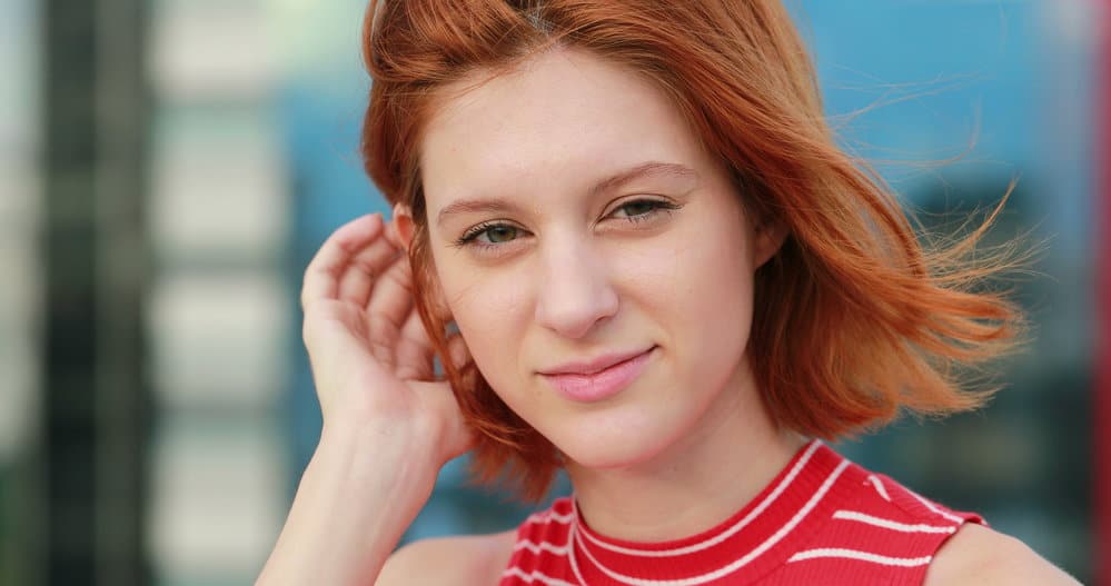 Embracing the beauty of short hair, the young woman is wearing one of our favorite haircuts for teenage girls - a versatile and fashionable short hair style.