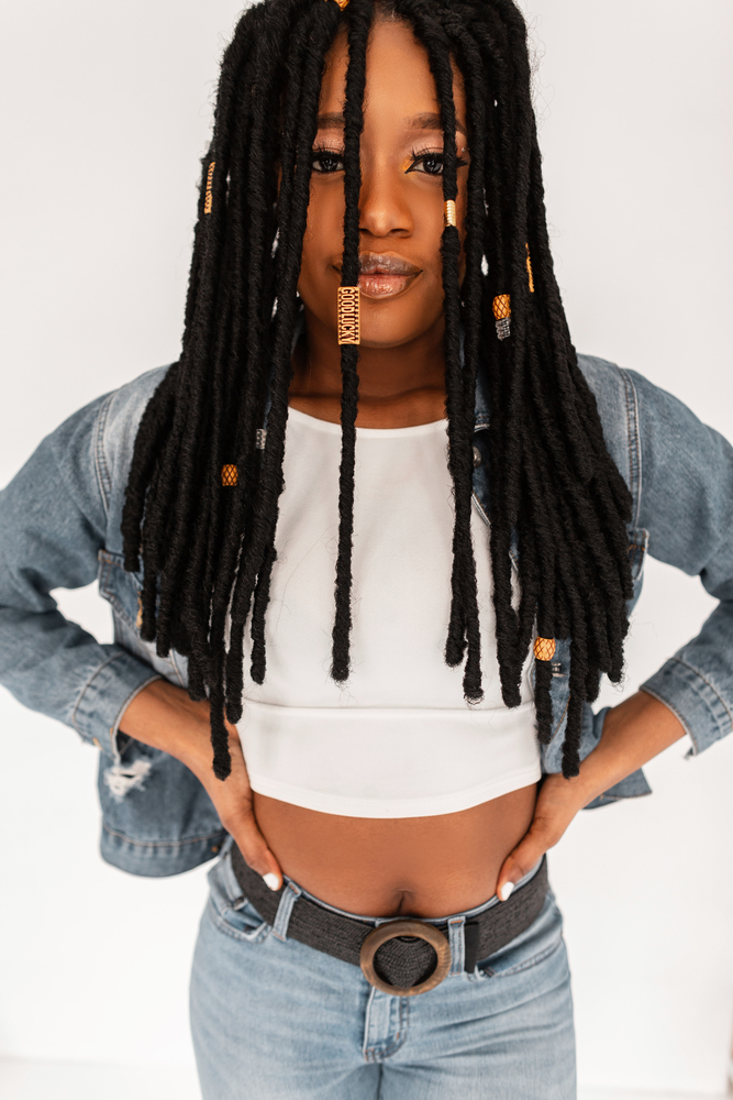 Her crocheted locs are protected from damage and styled with a soft touch, making them a great choice for anyone with natural hair that wants to install soft locs.