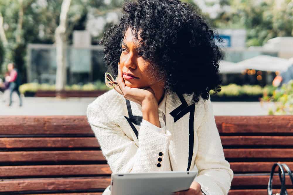 This curly girl follows the Curly Girl Method, using a deep conditioner and moisturizing conditioner to keep her natural curls healthy and well-moisturized.