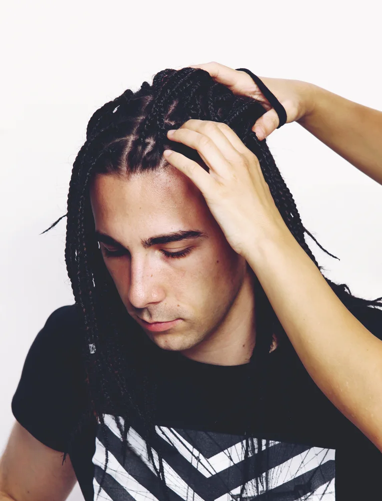 White Boy Braids: Braided Styles for Caucasian Men and Boys 21 The woven man braids on the white guy's head draw attention to his unique sense of style, blurring the boundaries between cultural aesthetics.