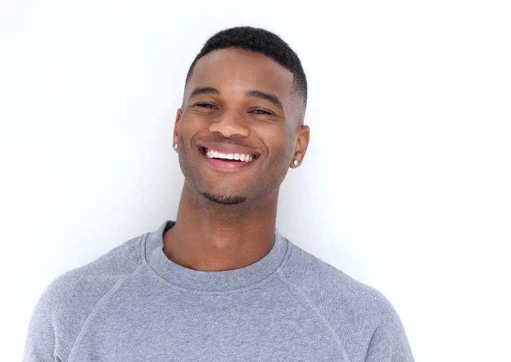 7 Best Edgers for Black Hair: Top Hair Clippers & Hair Edgers 4 Armed with the best hair clippers and a styling comb, this talented man effortlessly trimmed his beard hair and body hair, highlighting his grooming prowess and his ability to maintain a sleek and polished appearance.