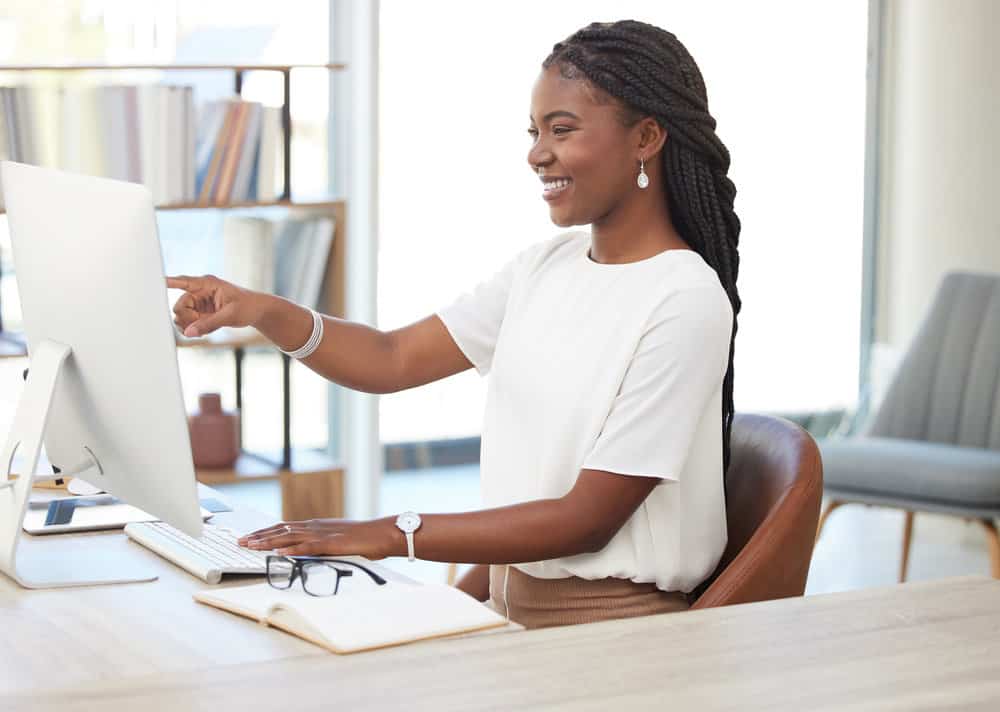 With her boho knotless braids, she embraces the versatility of this technique, allowing for more natural-looking and voluminous protective hairstyles.