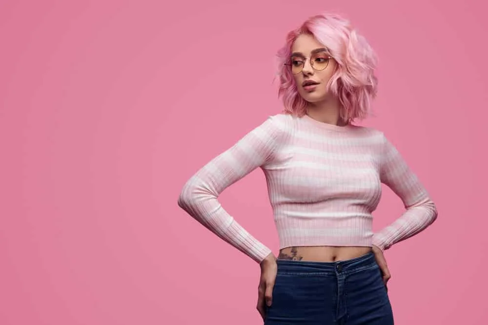 How to Use Wella T50 Toner Before and After: Wella Pink Blossom 7 Wella toner helped a lady with naturally light blonde hair achieve a cool-toned ash blonde shade without any warm or brassy tones, making her natural curls stand out beautifully.