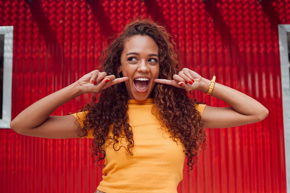 How to Wash Curly Hair: DIY Shampoo or Co-Wash Curly Hair 6 She handles her hair gently, understanding the importance of preserving its natural oils for healthy, frizz-free curls.