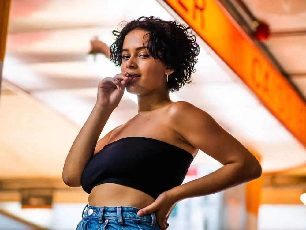 The Bisexual Haircut: How to Create Bi Haircuts & Hairstyles 3 With her straight hair styled into a bisexual bob, the young woman embraces a unique and inclusive hairstyle celebrated by bi ladies.