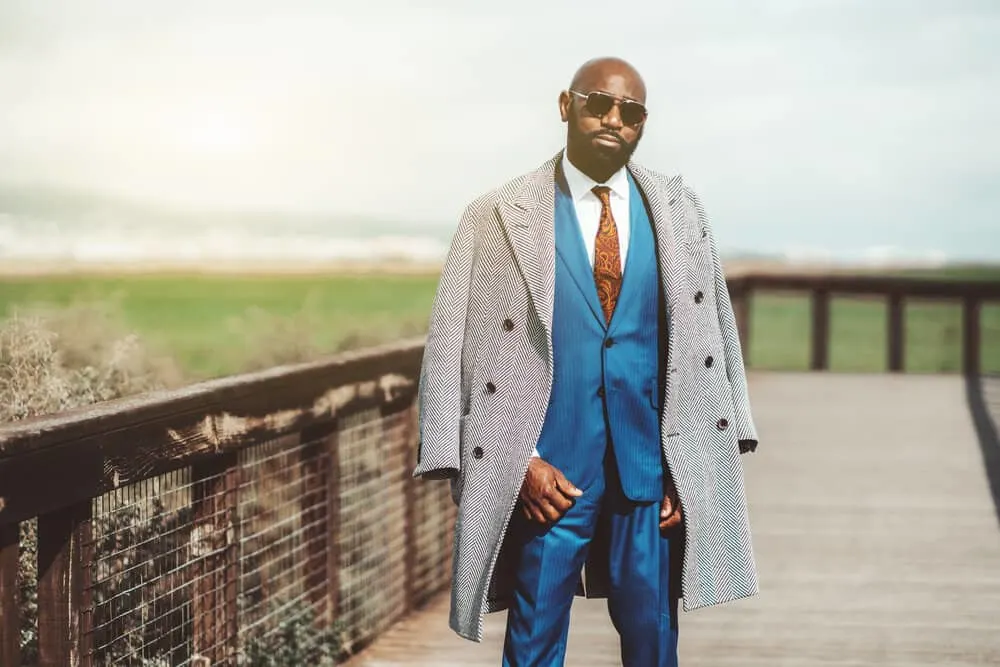 Haircuts for Balding Men: Best Balding Haircuts and Styles 17 With his all-over-shaved head, the African man embraces his balding spots with thick hair on his beard and exudes a bold and masculine style.