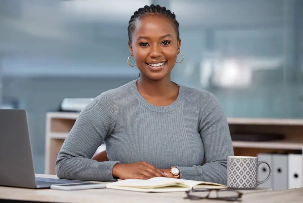 Feed-in Braids: How to Do Feed in Braid Styles for Beginners 1 A stunning black female wearing human hair extensions with thin feed-in box braids creates a gorgeous protective hairstyle with braid cuffs.