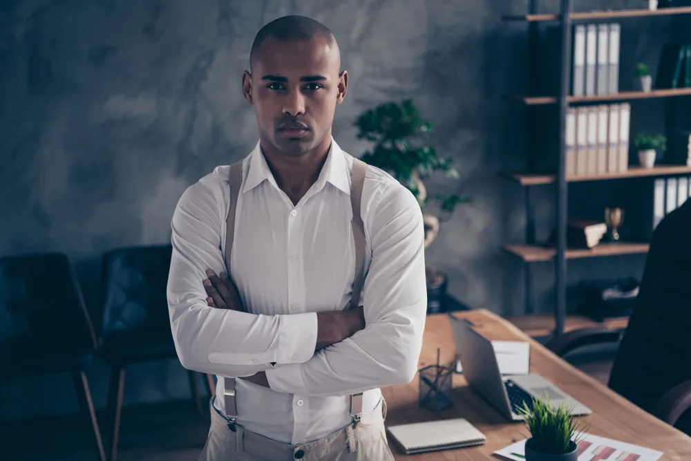 Best Clippers for Black Hair: Top Trimmers & Hair Clippers 10 Equipped with a top-rated professional hair clipper, he effortlessly glides the cordless trimmer through his afro hair, achieving precise and stylish results.