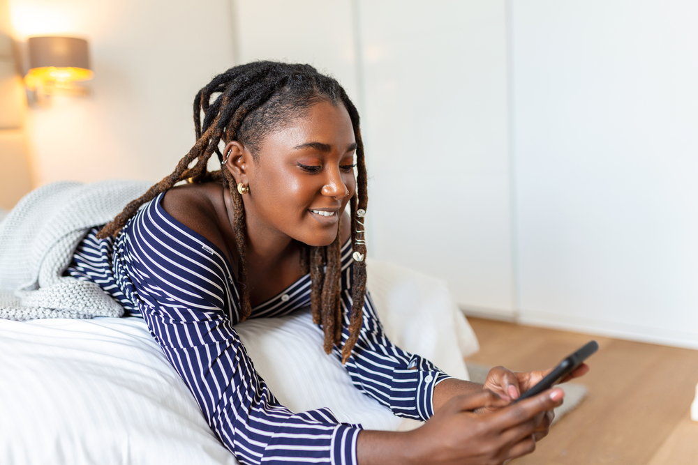 With her dark skin complementing her instant dreads, which started as comb coils on her shoulder hair length, she exudes confidence and style.