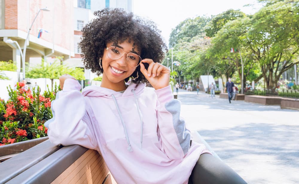 With her effortless black curly waves, this girl radiates charm and grace, embracing her natural texture with confidence.