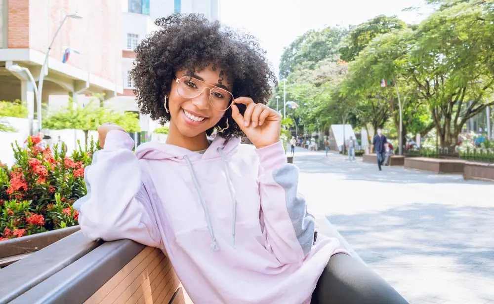Black Girl Curly Hairstyles: 10 Curly Hairstyles for Black Women 6 With her effortless black curly waves, this girl radiates charm and grace, embracing her natural texture with confidence.