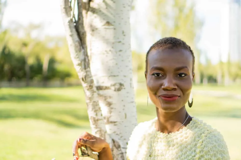 23 Short Hairstyles for Women over 60: Hair Styles & Haircuts for Women 2 The young African American woman confidently rocks her natural curls in one of the most popular short haircuts for women, showcasing her fine hair beautifully.