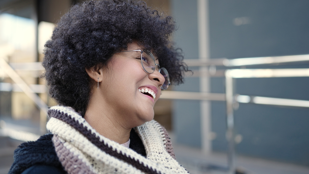 Using a combination of whipped shea butter and organic gel, this black woman creates a stunning curly hairdo that protects her strands and promotes hair growth.