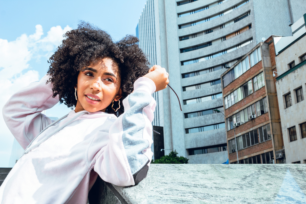 Whether she's rocking short natural hair or long flowing curls, this girl's curly hairstyles are a true expression of her style.