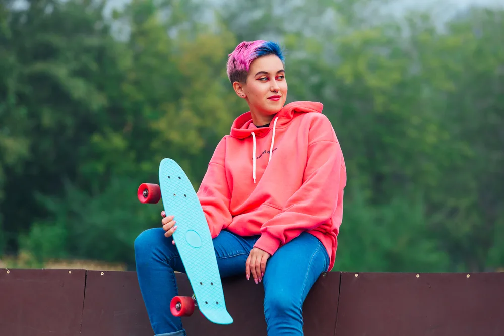 Enby Haircuts: 16 Cute Enby Haircut Styles for All Hair Types 16 The androgynous style she rocks combines elements of traditionally feminine and masculine haircuts, creating a unique and captivating look.