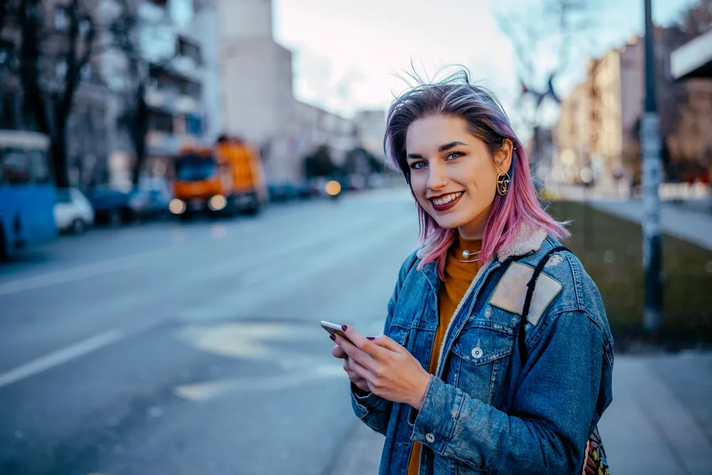 What Color Cancels out Purple? Does Yellow Cancel out Purple? 7 The dark purple hair color contrasts beautifully against her blonde roots, creating a striking visual effect.