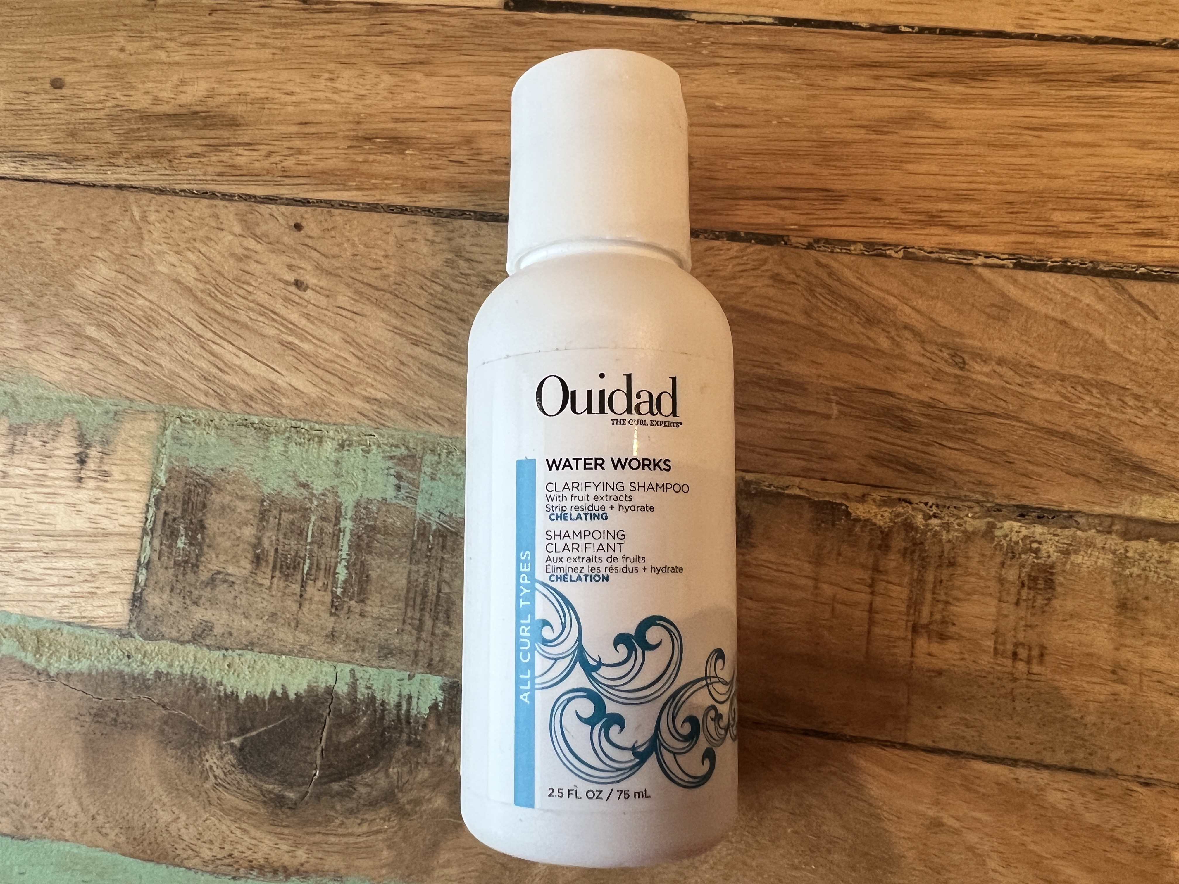 Ouidad: The Curl Experts - Water Works clarifying shampoo with fruit extracts.