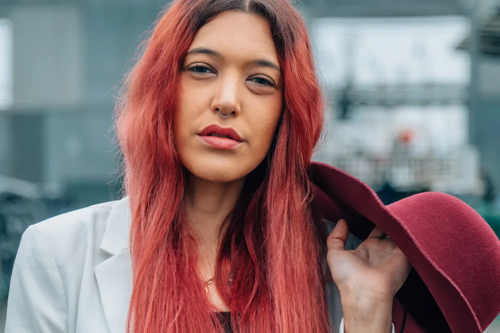 Aesthetic E-Girl Hair: Color Ideas, Hairstyles, and Haircuts 17 Her hair clips are carefully chosen to match her colorful hair, adding an extra touch of personality to her style.