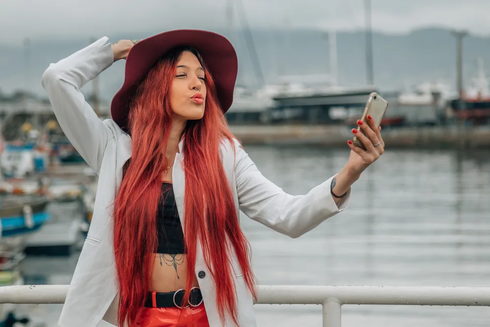Aesthetic E-Girl Hair: Color Ideas, Hairstyles, and Haircuts 21 Her blue hair adds a touch of whimsy to her e-girl style, making her stand out from the crowd.