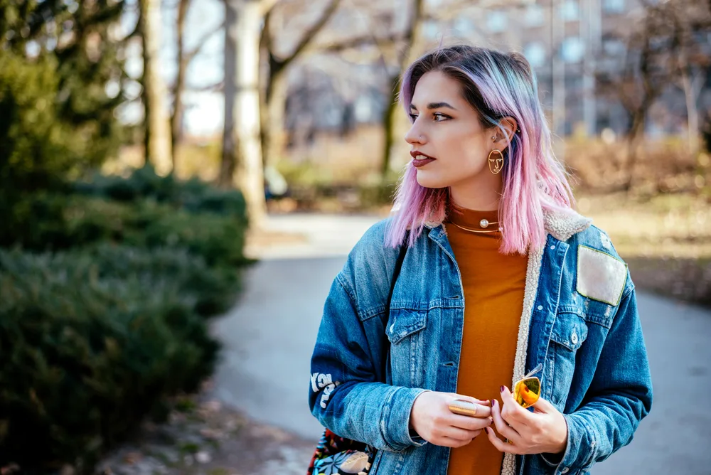What Color Cancels out Purple? Does Yellow Cancel out Purple? 4 Her hair glistens with a deep purple hair color that adds a touch of whimsy to her overall dark brown hair strands.