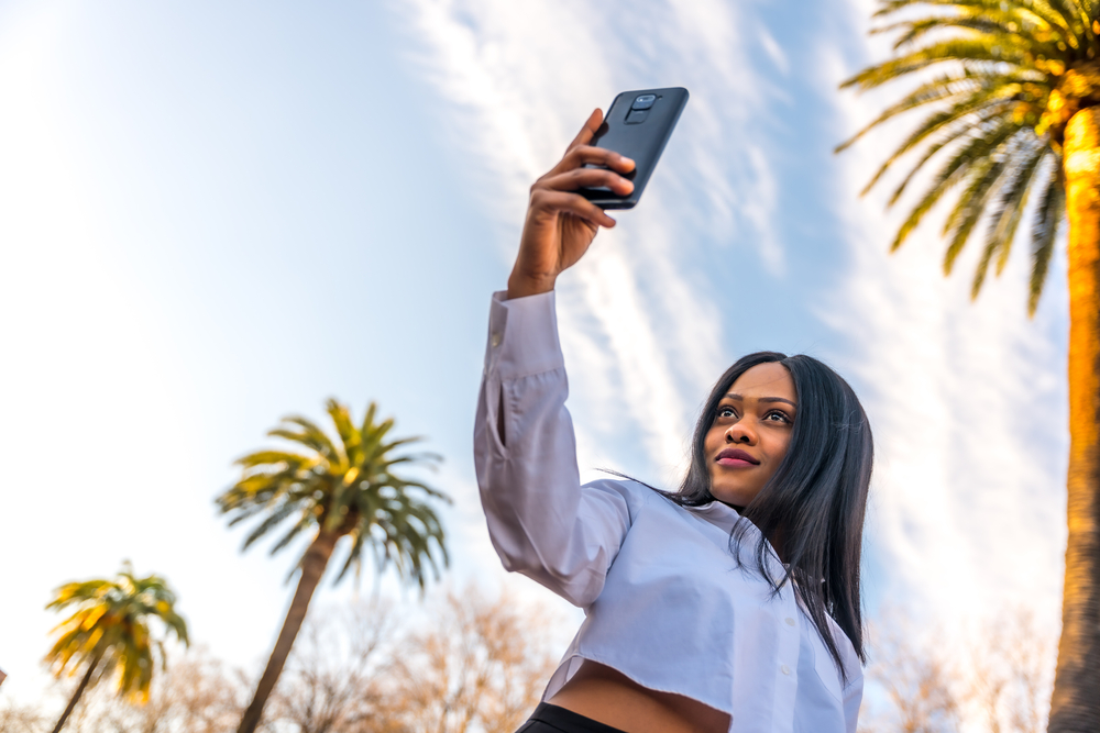 Rocking a stylish wig, she confidently showcases the versatility of black women's hairstyles and the beauty of hair wigs.