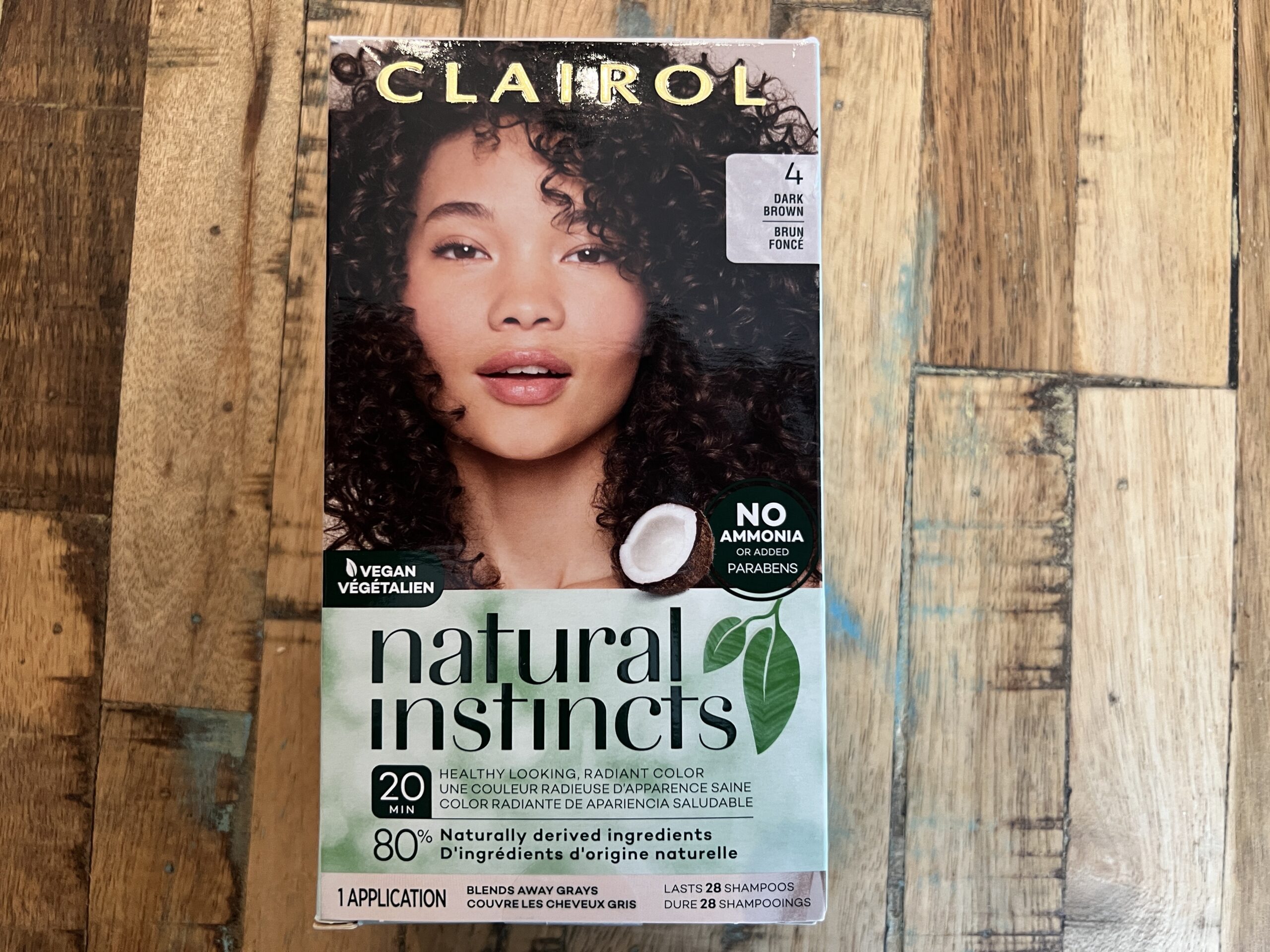 This box of ammonia and paraben-free Clairol Natural Instincts dark brown demi-permanent hair dye is vegan and includes naturally derived ingredients.