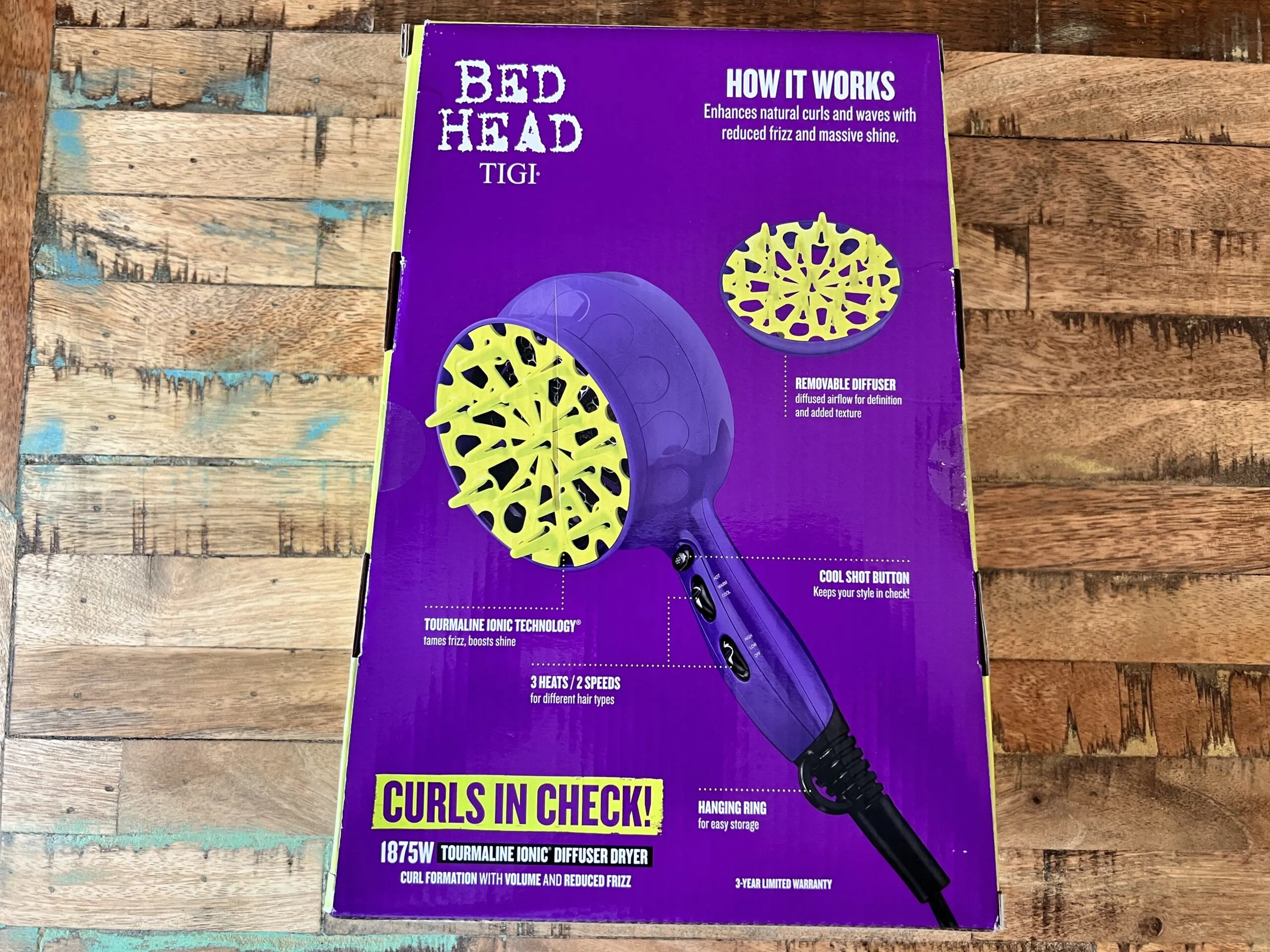 The Bed Head TIGI 1875-watt tourmaline ionic diffuser dryer works to enhance your natural curls and waves with reduced frizz and massive shine. The box also included a removable diffuser to pair with the diffuser dryer that comes with a cool shot button, hanging ring, 3 heats, and 2 speeds.