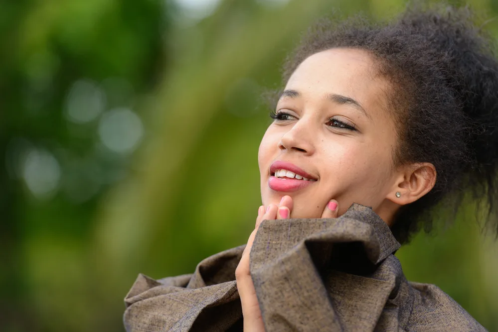 Types of Hair Clips: Your Detailed Guide to Hair Clip Types 16 This stunning updo, secured with various types of claw hair clips and banana hair clips, celebrates the beauty and diversity of natural hair, embracing the unique texture and style of her fine kinky hair.