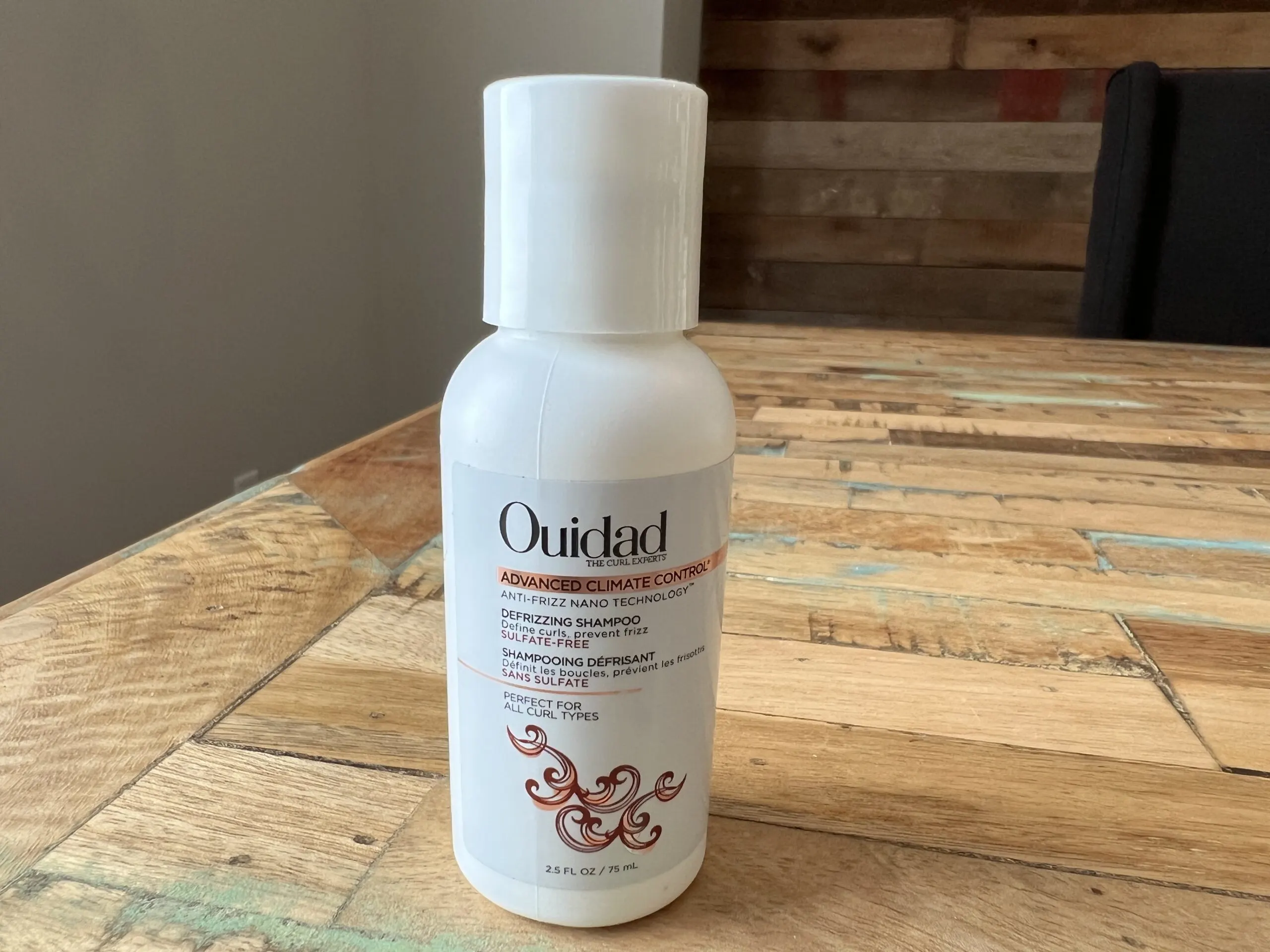 Ouidad: The Curl Experts - Defrizzing shampoo with advanced climate control and anti-frizz nano technology can define curls and prevent frizz. 