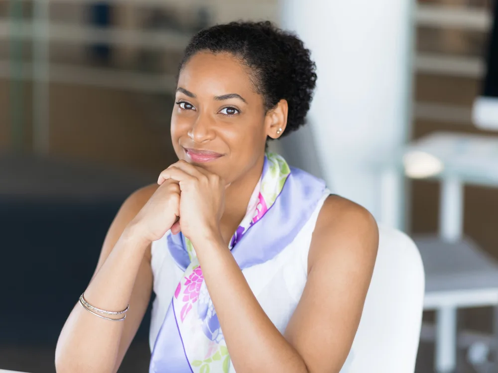 Hair Spray vs. Gel: Is Hair Gel or Hair Spray Better? 4 A beautiful African American female wearing a finished style that used oil-based pomades to add texture.