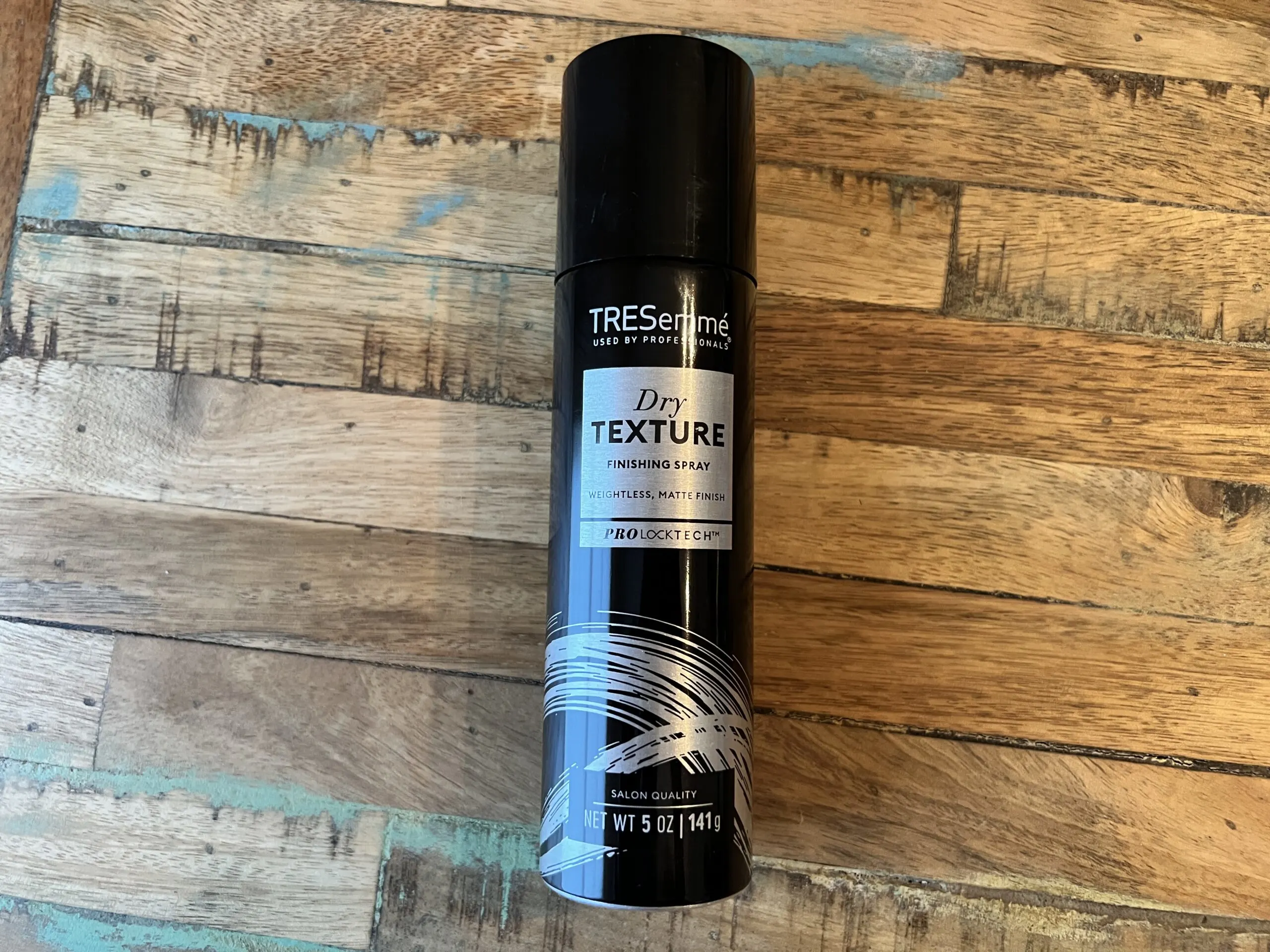 TRESemmé Used by Professionals - Dry Texture Finishing Spray with a weightless, matte finish.